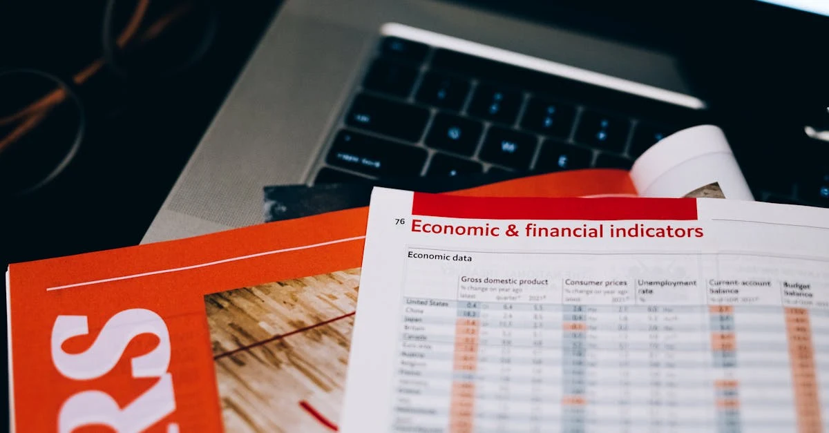 Financial spreadsheet with economic indicators data displayed on paper next to laptop keyboard for ecommerce financial model.