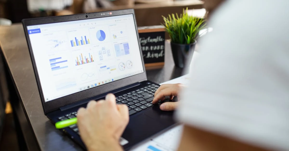 Person analyzing ecommerce revenue optimization dashboard on laptop displaying sales charts and analytics data.